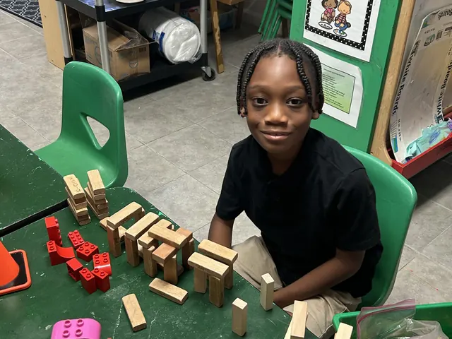 Child building with blocks in a Leading Learners Academy classroom