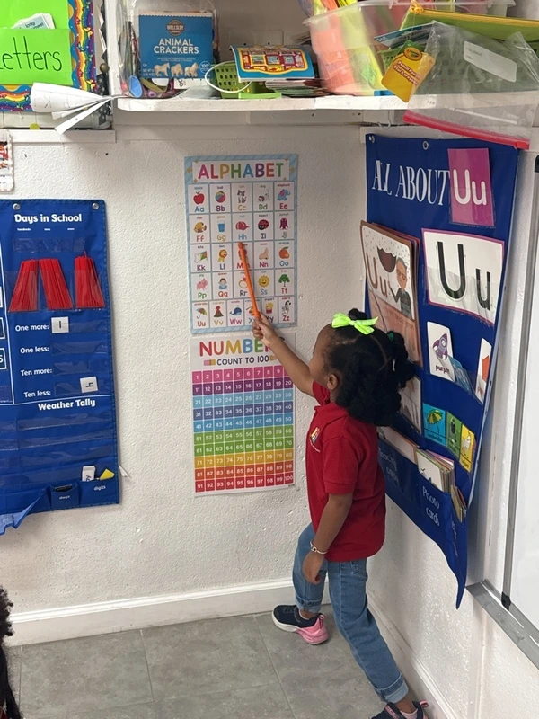 Child participating in early literacy learning